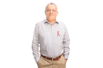 Cheerful senior posing with an AIDS badge