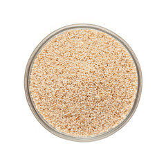 Top view of Organic White Poppy seed (Papaver somniferum) in glass bowl isolated on white background.