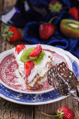 Cake meringue cakes with strawberries and kiwi.selective focus