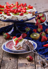 Fototapeta na wymiar Cake meringue cakes with strawberries and kiwi.selective focus