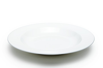 Empty white plate on sack background.