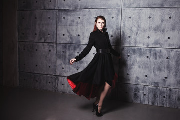 Elegant young woman posing in coat, hoto Studio