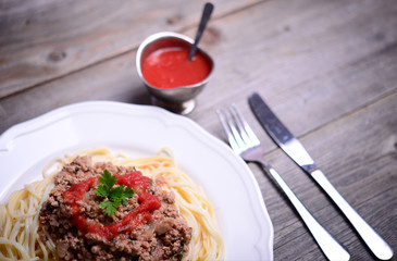 Italian spaghetti on rustic wooden table