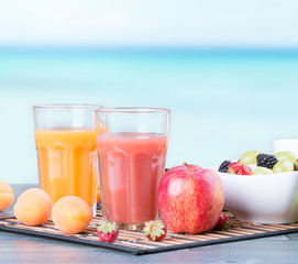 Fresh juice on wooden table 