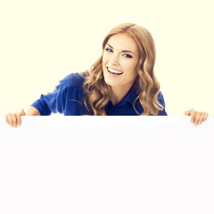 young businesswoman showing signboard with copyspace