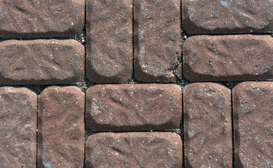 Old red pavement closeup.