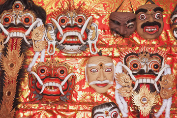 Traditional balinese masks for folk show Topeng, canonical masks of Rangda spirit for ritual temple dances. Arts, religion of Bali and culture festivals of Indonesian people. Asian travel backgrounds.