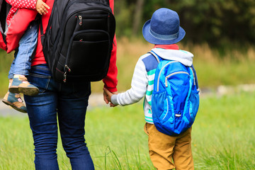 Mother with kids going to school or daycare