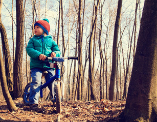 little boy on running bike outdoors, kids sport