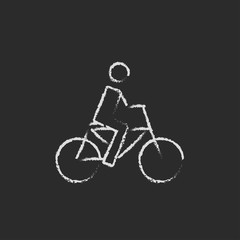 Fototapeta na wymiar Bike and cyclist icon drawn in chalk.