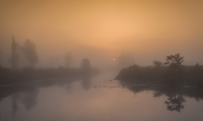 Obraz na płótnie Canvas A beautiful foggy sunrise