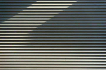 Fototapeta premium Shadows on the rhythmic surface striped