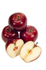 Healthy Red Delicious Apples/ Healthy red apples whole and sliced open showing seeds.  Isolated on white.