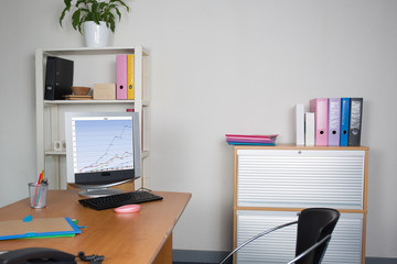 Modern office interior with tables,computer,  chairs and bookcases. Nobody
