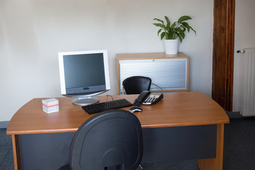 Modern office interior with tables,computer,  chairs and bookcases. Nobody