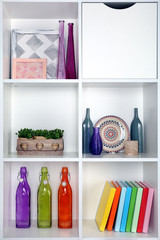 Beautiful white shelves with different home objects