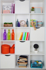 Beautiful white shelves with different home objects