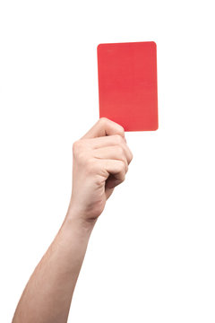 Soccer referee hand holding red card