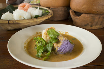 Pastel colored Thai rice noodle with curry fish soup