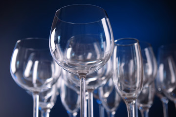 Empty wine glasses on blue background
