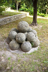 Fototapeta na wymiar Medieval stone cannonballs of Vicopisano Castle (Italy-Tuscany-Pisa)