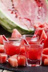 Summer watermelon celebratory drink with pulp and ice, selective
