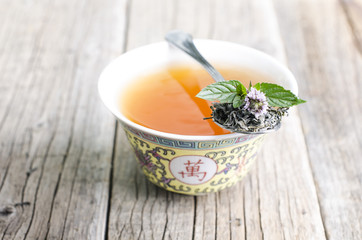 Cup of tea on a wooden background 