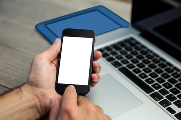 Cropped image of person using mobile phone