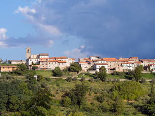 Fototapeta na wymiar Early morning in Lunigiana. The hilltop village of Moncigoli.