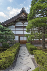 A symmetrical path leading to the door in a traditional Japanese building