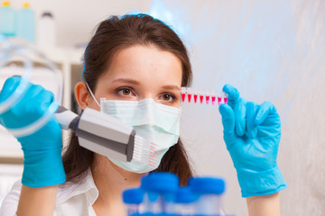 woman technician in microbiological laboratory