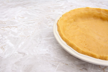 Close-up of pie dish lined with pastry