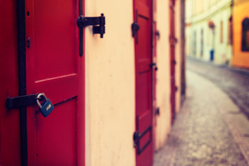 Red wooden door with lock