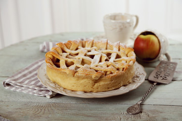 Homemade apple pie on wooden background