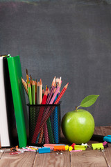 School and office supplies on classroom table © Evgeny Karandaev