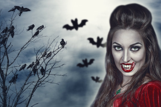 Beautiful witch on Halloween background