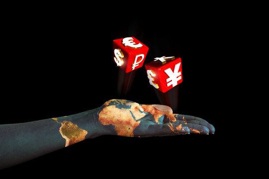hand pulling dice with symbols of international currencies
