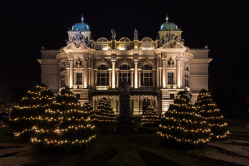 Juliusz Slowacki theatre in Krakow, Poland,  decorated for Christmas. Night view of illuminated XIXth century building, built in eclectic style.