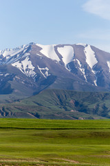 the snowy peaks of the Tien Shan Mountains. Kazakhstan