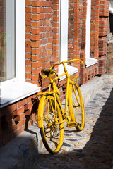Fototapeta na wymiar yellow bicycle on the street