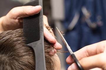 men's hair cutting scissors in a beauty salon