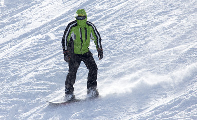 Fototapeta na wymiar man snowboarding in the winter