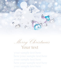 Christmas background with blue baubles,snow and snowflakes, free space for text. Christmas decoration. 