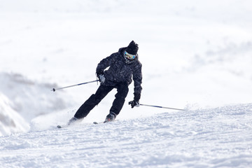 Skier in high mountains