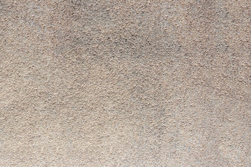Rough old brown cement wall.