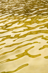 background of yellow surface of the water