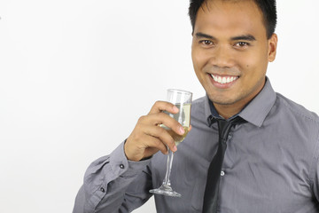 the new year - young filipino with a champagne flute