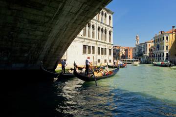 Fototapeta na wymiar Grand Canal with traditional Gondola under the bridge in Venice, Italy