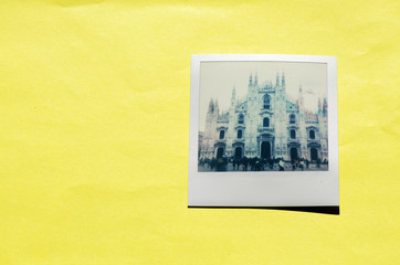 Instant photo on colored background. Polaroid Milan
