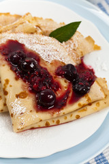 Blintzes or Pancakes with Blueberries. Selective focus.